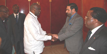President of Ivory Coast Laurent Gbagbo at a ceremony honouring India's Minister of State for External Affairs Anand Sharma with the country's highest civilian award