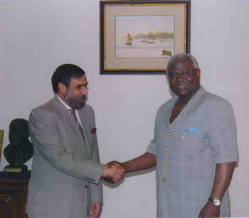 India's Minister of State for External Affairs Anand Sharma shaking hands with Sierra Leonean Presdient