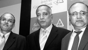 Mr S. Raman, Chairman and Managing Director, Canara Bank, flanked by Mr K. L. Jagdish Pai (left), and Mr H.S.U. Kamath, Executive Directors, at a press conference in Bangalore on Wednesday. 