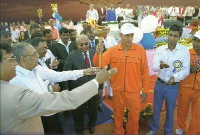 Iffco MD, Dr U S Awashti, handing over the Inter Unit Sports Festival torch to Paradeep team in December, 2009
