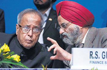 Finance Minister Pranab Mukherjee with Finance Secretary R S Gujral