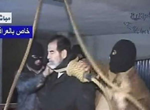 A frame grab from Iraqi state televison shows a noose being placed around Saddam Hussein's neck