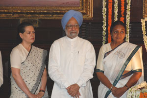 Prime Minister Manmohan Singh, Lok Sabha Speaker Meira Kumar and UPA Chairperson Sonia Gandhi seen after paying floral tributes at the portrait of Rajiv Gandhi in the Central Hall of Parliament House on his birth anniversary on August 20, 2009.