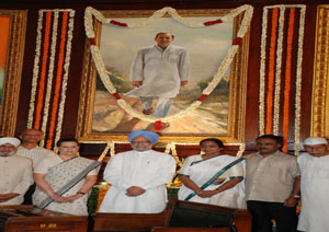 Prime Minister Manmohan Singh, Lok Sabha Speaker Meira Kumar and UPA Chairperson Sonia Gandhi seen after paying floral tributes at the portrait of Rajiv Gandhi in the Central Hall of Parliament House on his birth anniversary on August 20, 2009. Also seen is the photograph is Lok Sabha Secretary-General P.D.T. Achary.